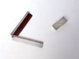 a small comb and a small comb on a white surface