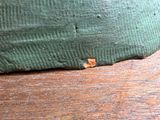 a close up of a piece of wood with a hole in it