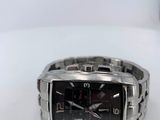 a close up of a wrist watch on a white surface