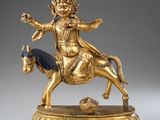 statue of a man on a horse with a ball in his hand