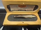a box with a knife, fork, and knife sharper in it