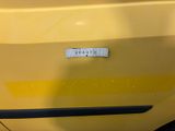a sticker on the door of a yellow car