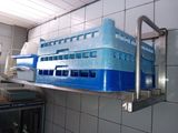 a picture of a blue and white building on a shelf