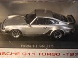 a silver porsche 911 turbo car in a display case