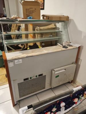 a counter with a glass case on top of it