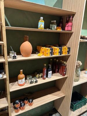 a wooden shelf with jars and jars on it