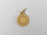 a gold plated charm with a circle on it