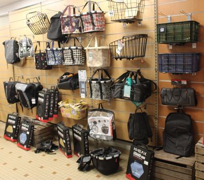 many bags hanging on the wall in the store