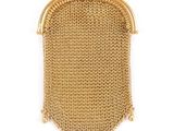 an antique gold mesh purse with a chain handle
