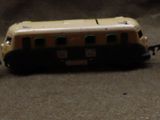 three toy trains sitting on a table next to each other