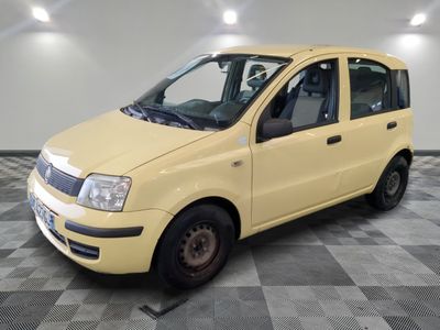 a picture of a small yellow car parked in a garage