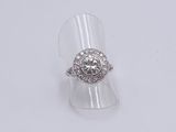 an image of a diamond ring on a clear acrylic stand