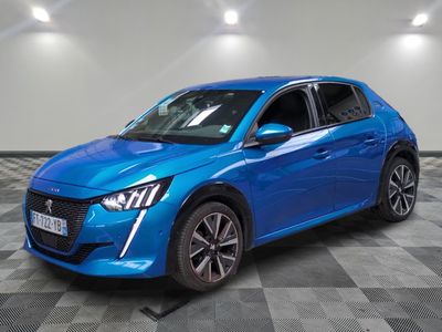 a blue car is parked in a room with a checkered floor
