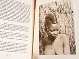 an open book with a picture of a woman in a headdress