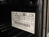an image of a close up of an oven with a label on it