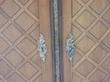 a wooden door with a metal handle on it