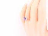an image of a woman ' s hand with a ring on it