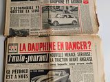 two pages of old french newspapers on a white surface