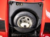 a close up of a tire on a red car