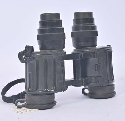an image of a pair of binoculars sitting on top of a white surface