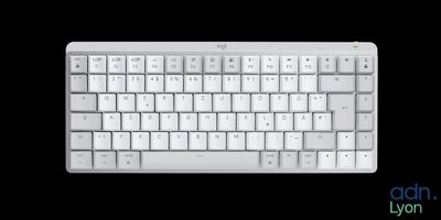 a computer keyboard with a white key board on a black background