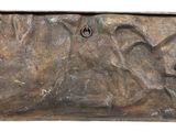 a metal plaque with a horse on it on a white background