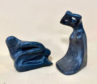 pair of blue ceramic figures of a cat and a dog