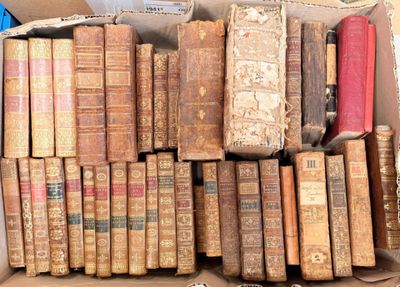 a box full of old books sitting on a table