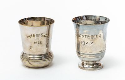 pair of silver goblets with engraved names on each of them