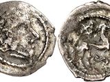 a silver coin with an image of a woman on it