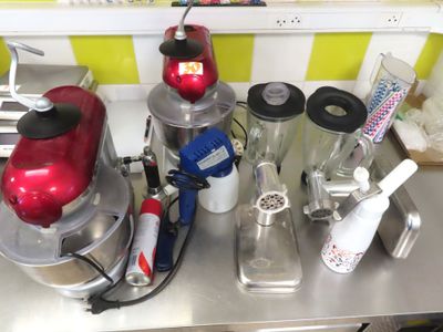 many different blenders on the counter in this kitchen