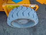 a tire on the back of a construction vehicle