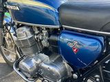 a blue motorcycle parked in front of a building