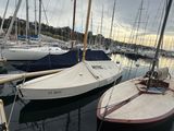 many boats that are docked in the water together