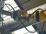 a yellow machine that is hanging from the ceiling