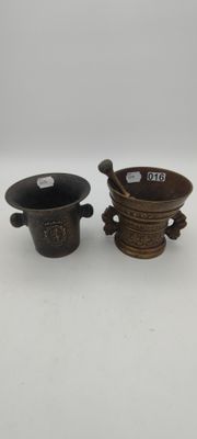 a pair of chinese bronze tea cups and saucers