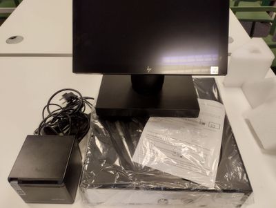 a computer monitor sitting on top of a white table