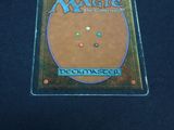the back cover of a card game with a picture of a circle on it