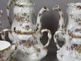 several pieces of porcelain tea and coffee set on a table
