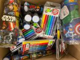 a cardboard box filled with assorted toys and supplies