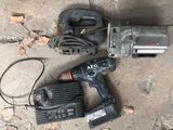 a corded drill and a corded hammer on the ground