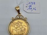 a close up of a gold medal on a white surface