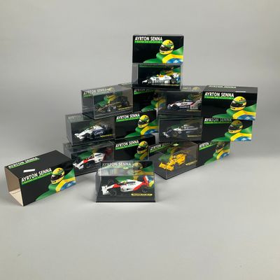 a group of toy cars are stacked up on a white surface