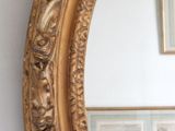 a mirror that is hanging on the wall in a room