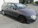 a picture of a grey car parked in a parking lot
