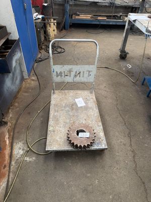 a picture of a machine shop with a gear wheel on it