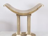 a close up of a wooden bench on a white surface