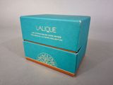 a small blue box with a lid on a table