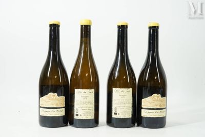 three bottles of wine sitting next to each other on a white surface