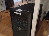 a computer that is sitting on a hard wood floor